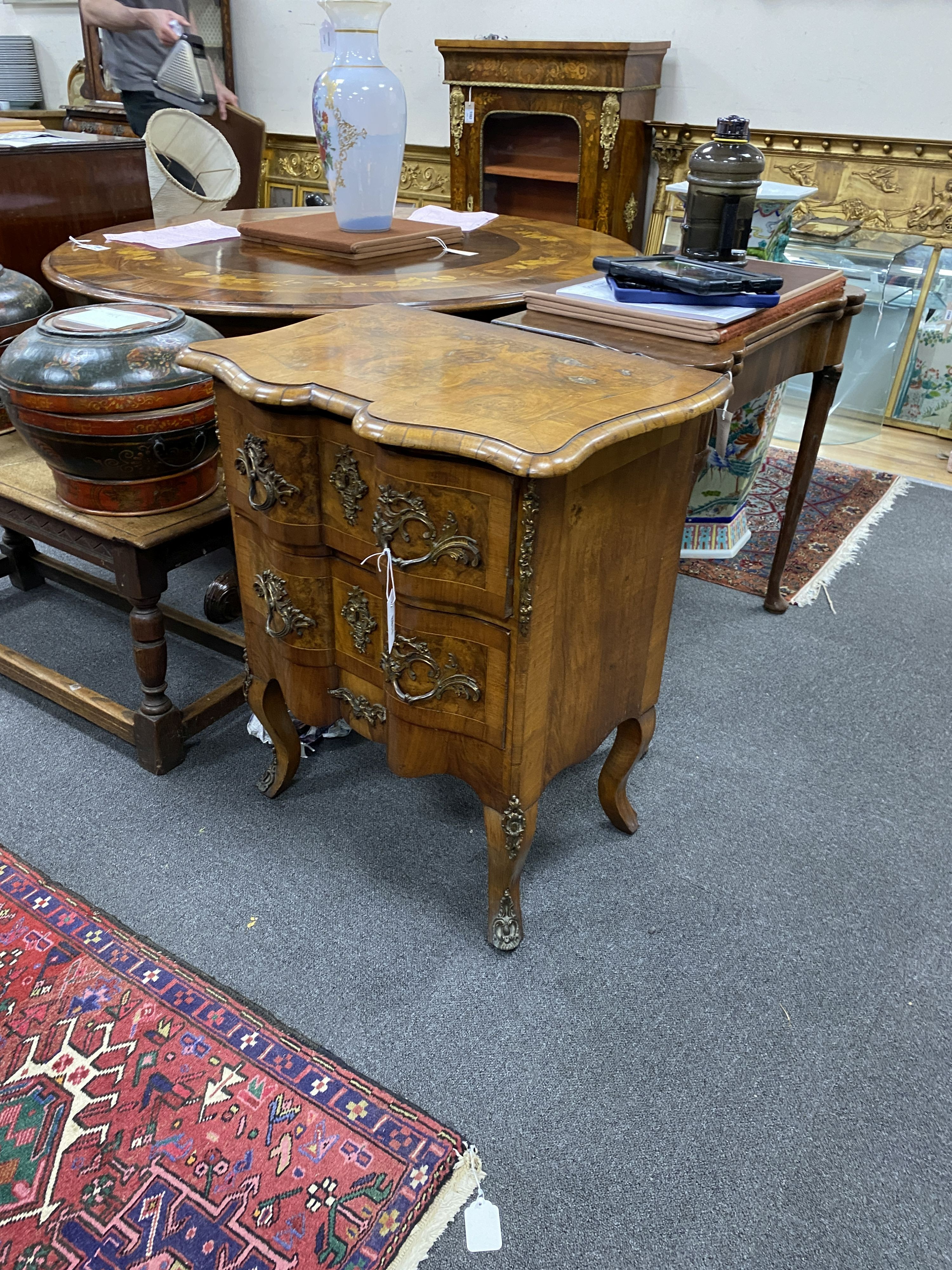 An early 20th century French gilt metal mounted walnut petit commode, width 62cm, depth 44cm, height 76cm